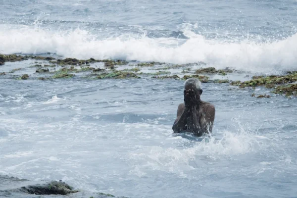 Man swimming at talpe beach