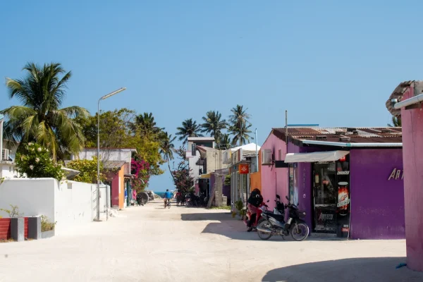 Local houses on Thulusdhoo with blue sky and white streets